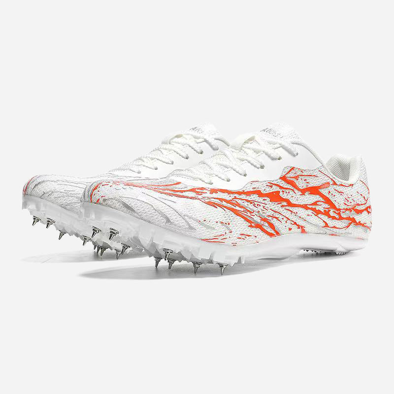 White and orange running shoe with cleats on a white background