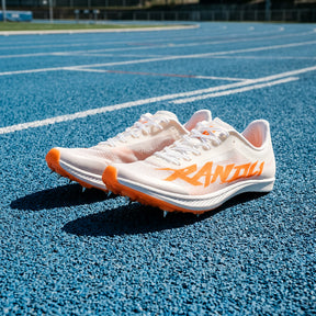 Flash RD1 Sprint Track Spikes on a blue running track.