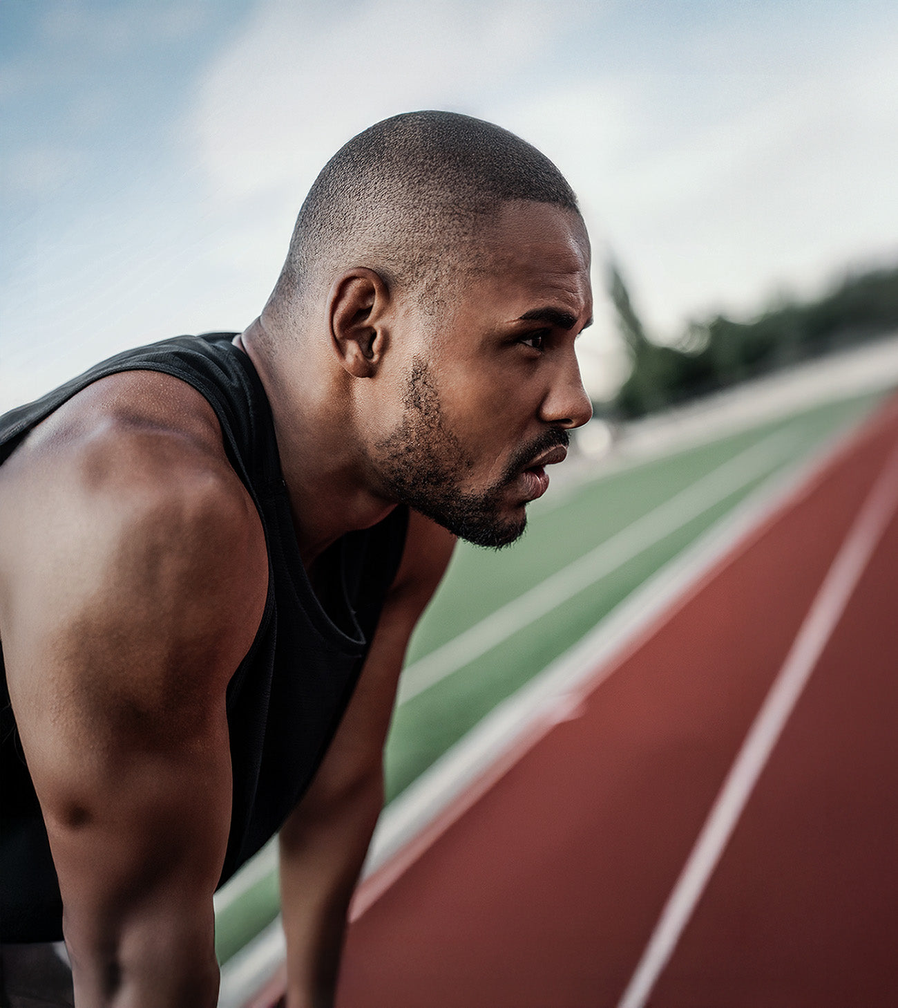 Man standing on running track