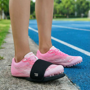 Track Spikes Shield Covers standing on running track