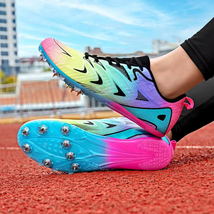 Colorful running shoes with spikes on a track