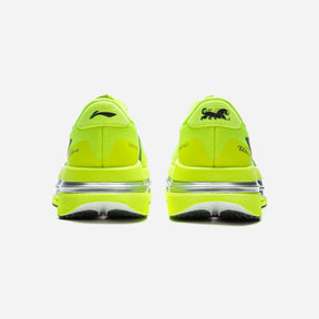 A pair of bright neon yellow athletic sneakers shown from the back on a light gray background.