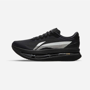 A black running shoe with a prominent white and gray patterned side stripe, black laces, and a thick black cushioned sole, shown in profile against a light gray background.