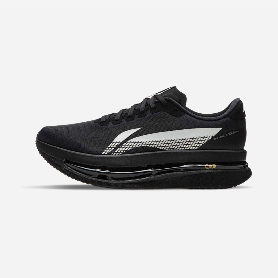 A black running shoe with a prominent white and gray patterned side stripe, black laces, and a thick black cushioned sole, shown in profile against a light gray background.